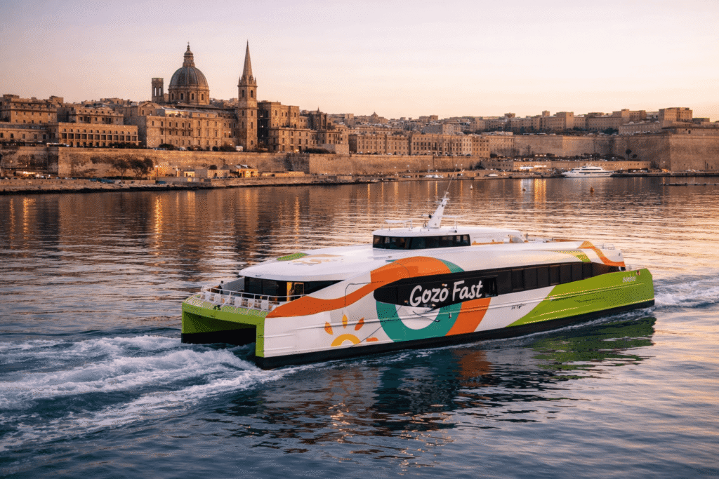 Malta, Valletta fast ferry arival from Gozo , harbour architecture, soft evening light, calm reflections