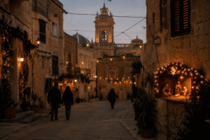 Quiet Christmas evening in Gozo with warm festive lights, limestone streets, and subtle local atmosphere.